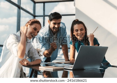 Group of happy businesspeople celebrate their successful project. Professional business team win and proud of their project at modern office. Successful teamwork, happy colleague, workplace. Tracery. Royalty-Free Stock Photo #2416186621