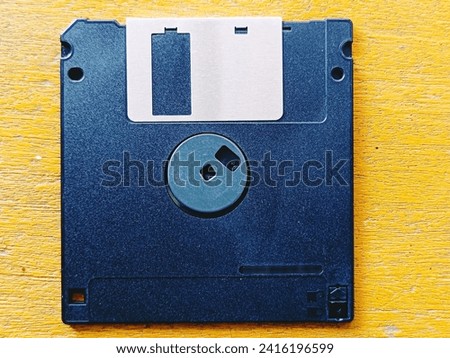 Floppy disk on a yellow background