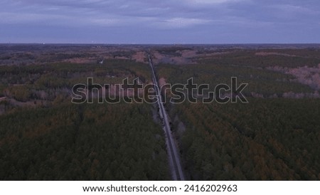Areial drone pictures of the train tracks the forest water the lake sunsets  
