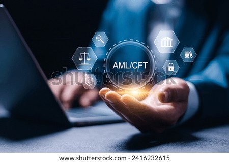 AML : Anti Money Laundering and CFT : Countering the Financing of Terror regulations and compliance concept. businessman use laptop with virtual AML and CFT icons. Royalty-Free Stock Photo #2416232615