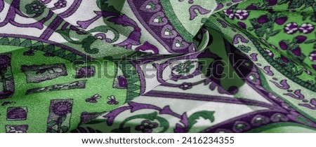 Silk fabric, royal monogram, white color, azure green on the fabric. your design will be imbued with the spirit of the Middle Ages. Textured background pattern Royalty-Free Stock Photo #2416234355