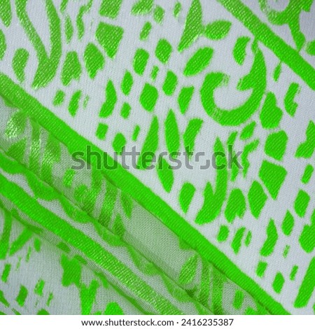 Silk cloth, green cloth. Shades of delicate exquisite flowers on a white background, photo of Paisley print. Texture, pattern, collection