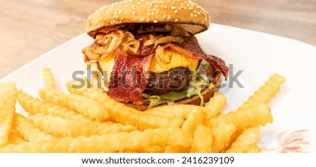 Beef Cheese burger with bacon and fries