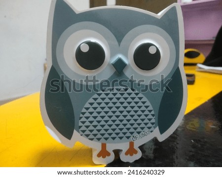 picture of an owl in grey shade