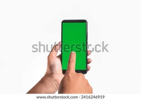 closeup of hands holding smart phones with green screen and showing using device isolated on white background, person sharing media transfer data files, touching monitor, free copy space