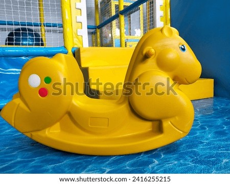 toy horse in the indoor playground