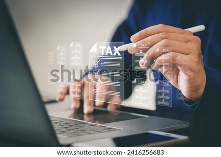 Tax concept. Person using computer to fill out personal income tax return to pay taxes online. State tax. Financial research. data analysis, documents, reports, tax returns, calculations. Royalty-Free Stock Photo #2416256683