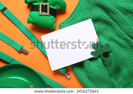 Blank card with leprechaun hats, sweater and suspenders on green background. St. Patrick's Day celebration