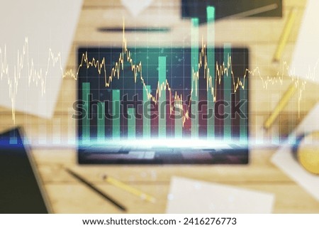 Multi exposure of abstract financial diagram and modern digital tablet on background, banking and accounting concept