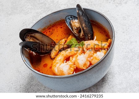 seafood soup on the stone background