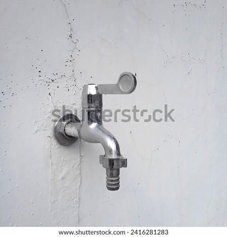 Home terrace faucet attached to wall building applicated in front house terrace yard or car port