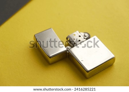 The grey lighter staying on the isolation Royalty-Free Stock Photo #2416285221