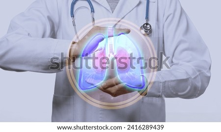 Doctor using virtual screen with picture of lungs on light background