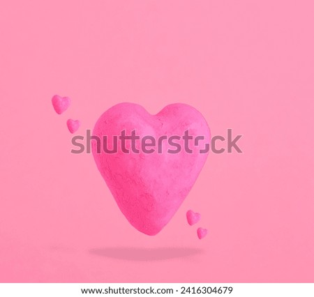 Shabby pink hearts on pastel pink background. St. Valentines day card.