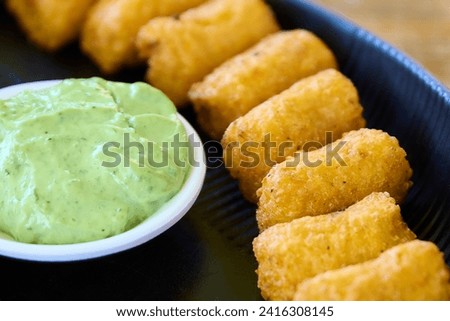 Croquettes with guacamole and mayonnaise