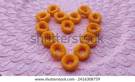 this is a picture of snacks on a pink background