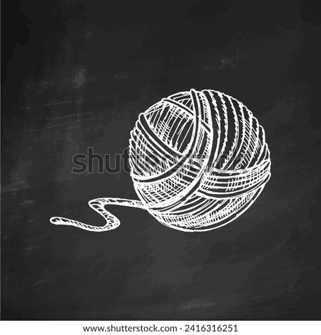 Hand drawn sketch of ball of threads on chalkboard background. Handmade, knitting equipment concept in vintage doodle style. Engraving style.	
