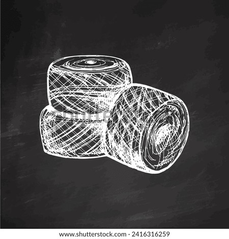 Hand drawn sketch of balls of threads on chalkboard background. Handmade, knitting equipment concept in vintage doodle style. Engraving style.	