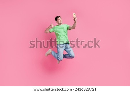 Full length size photo of handsome guy thumb up like symbol selfie portrait shot made on smartphone isolated over pink color background