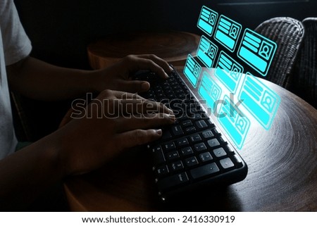 Close up hand typing on the keyboard with digital card icon on front.Online and modern technologies for simplifying the human resources system