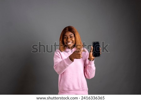 Beautiful emotional girl holding smart phone