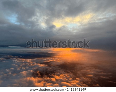 Beautiful sunset time picture from an airplane with colorful skies and clouds