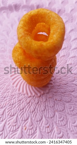 this is a picture of snacks on a pink background