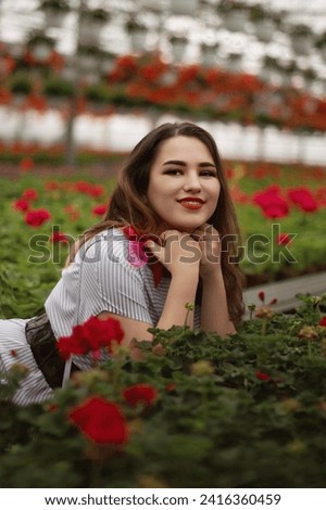 Black hair girl with make up in garden of pink flowers