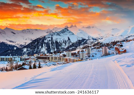 Majestic winter sunrise landscape and ski resort in French Alps,La Toussuire,France,Europe Royalty-Free Stock Photo #241636117