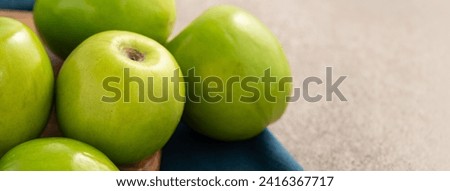 Fresh juicy delicious Taiwanese Milk Indian Jujube fruit in a basket on gray table background. Royalty-Free Stock Photo #2416367717