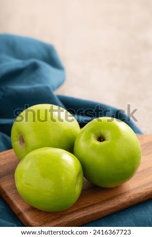 Fresh juicy delicious Taiwanese Milk Indian Jujube fruit in a basket on gray table background. Royalty-Free Stock Photo #2416367723