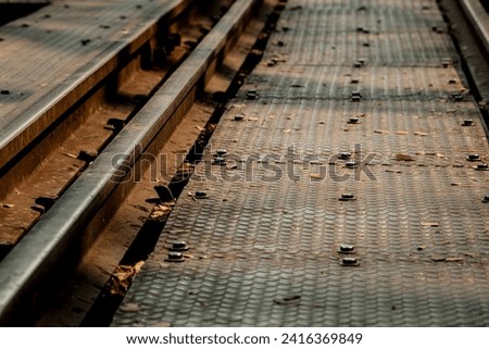 The close-up low angle of the old World War II metal railway across river Kwai in Kanchanaburi province, Thailand