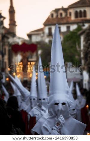 Penitents in a traditional procession during the Spanish easter Royalty-Free Stock Photo #2416390853