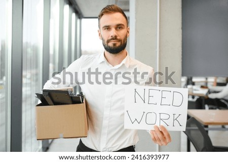 Man by dismissal. Guy lost job. Fired manager in company. Dismissal box in hands of employee. Man office worker disappointed by dismissal. Fired male in blurred office. Discharge company employees Royalty-Free Stock Photo #2416393977