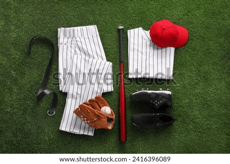 Flat lay composition with baseball equipment on artificial grass Royalty-Free Stock Photo #2416396089