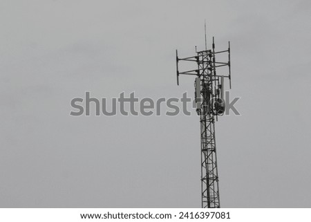 A towering telephone signal transmitter tower
