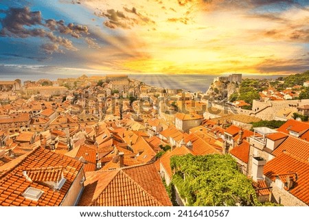 Aerial view on Dubrovnik walls of Croatia at sunset. View of Fort Lovrijenac fortress and Franciscan friary, church Monastery. Saint Biagio of Dubrovnik UNESCO Venetian town of Croatia in Dalmatia Royalty-Free Stock Photo #2416410567