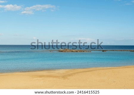 Cyprus Closed Maraş Beach. Maraş, one of the most famous holiday resorts of the Mediterranean before 1974, was captured by the Turkish Armed Forces during the Second Cyprus Operation on 13 August 1974 Royalty-Free Stock Photo #2416415525