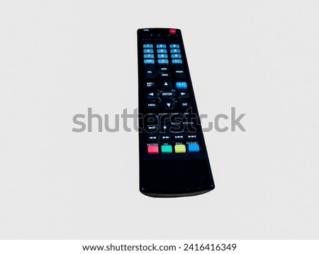 Black remote control for tv on a white background.