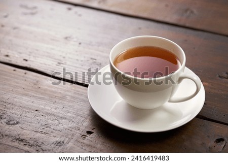 Image of drinking hot tea at tea time Royalty-Free Stock Photo #2416419483