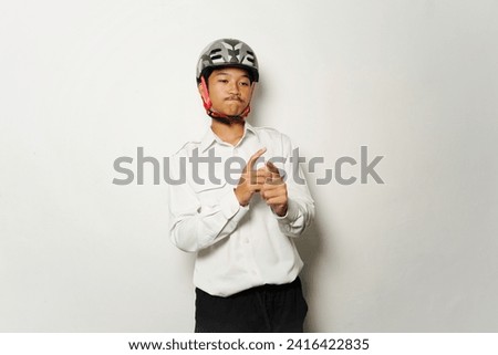 A young boy wearing bike helmet going to work - Bike to work style