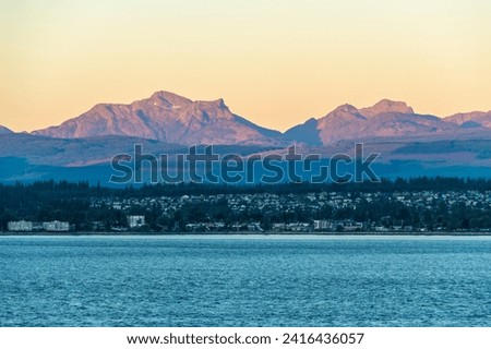 Campbell River at sunrise seen from Quadra Island, Vancouver Island, British Columbia, Canada. Royalty-Free Stock Photo #2416436057