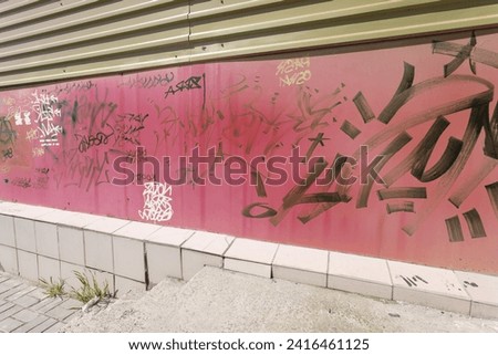 Beautiful underground street art. Abstract creative patterns of trendy colors on city walls. Urban contemporary culture. Abstract stylish drawing, wall mark, tag, graffiti fragment marking, Street art
