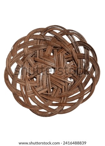 Rattan plates made from woven rattan are usually used to serve traditional food. osolaten on white background. 
