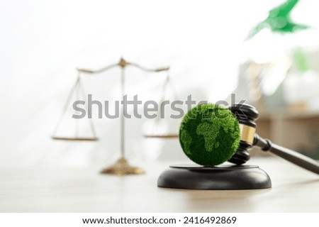 Green law concept. international environmental law Climate or environmental justice Law on green forest conservation economy Environmental protection. Legal hammer placed on the desk Royalty-Free Stock Photo #2416492869
