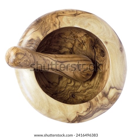 Old organic olive wood mortar and pestle isolated on white background. used for grinding ingredients in cooking.Close-up.  Royalty-Free Stock Photo #2416496383