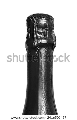 Champagne bottle neck black foil wrapper closeup isolated over white Royalty-Free Stock Photo #2416501457