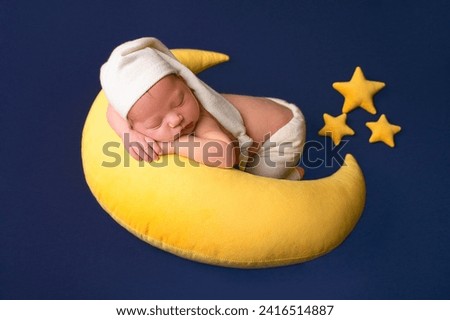 Newborn baby sleeping on the moon, photo shoot, cute babies, little boy Royalty-Free Stock Photo #2416514887