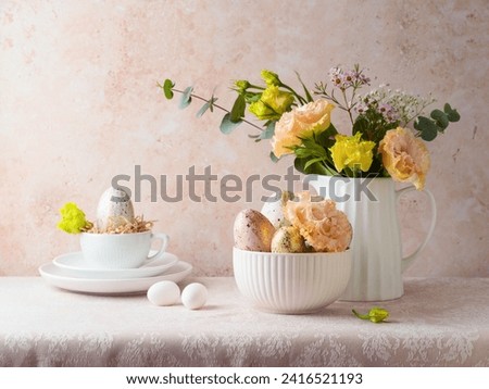 Easter holiday celebration with flowers bouquet and Easter eggs decoration on table over bright  background Royalty-Free Stock Photo #2416521193