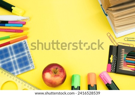 Back to school. Stationery on a yellow table. Office desk with copy space. Flat lay